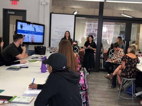 Members from the Old Navy Creative team talk to fashion design juniors about their industry insights before launching an industry project with students. 